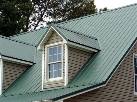 metal roof on green sided house|green metal roofing near me.